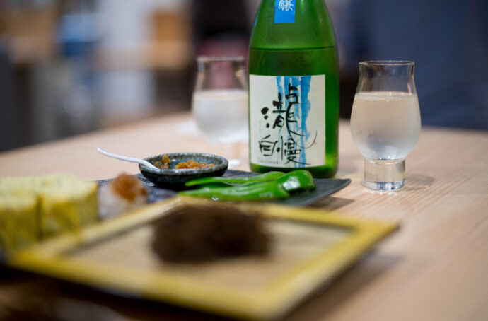 内田橋横丁 UCHIDABASHIYOKOCHＯ うちだばしよこちょ 愛知県名古屋市南区内田橋1-7-22 クレストビル名古屋内田橋1F  豊田本町 居酒屋  （株）富屋酒店 かぶしきがいしゃ とみやさけてん カブシキガイシャ　トミヤサケテン TOMIYA SAKETEN 　愛知県名古屋市瑞穂区上坂町1-41-2　地酒屋　豊盃　HOUHAI ほうはい　ホーハイ　三浦酒造  MIURASHUZO日高見　ひたかみ　ヒタカミ HITAKAMI  平孝酒造　HIRAKOSHUZO 天の戸 アマノト　あまのと　AMANOTO　浅舞酒造ASAMAISHUZO　飛露喜 HIROKISHUZOHONTEN　廣木酒造本店　HIROK　大那 DAINA　ダイナ　だいな　菊の里酒造　KIKUNOSATOSHUZO　旭興　KYOKUKO　きょくこう　キョクコウ　渡邉酒造　WATANABESHUZO　仙禽 SENKIN　せんきん　センキン（株）せんきん SENKIN鶴齢　カクレイ　かくれい KAKUREI　青木酒造　AOKISHUZO謙信 ケンシン　けんしん KENSHIN池田屋酒造 IKEDAYASHUZO 白岳仙 HAKUGAKUSEN　ハクガクセン　はくがくせん　安本酒造 YASUMOTOSHUZO 群馬泉 グンマイズミ　ぐんまいずみ 島岡酒造 SHIMAOKASHUZO  喜久醉 きくよい キクヨイKIKUYOI 青島酒造 AOSHIMASHUZO 長珍 ちょうちん　チョウチン長珍酒造CHOCHINSHUZO　みねたからみりん　峯寳 味醂　一子相伝 ミネタカラ　いっしそうでん　イッシソウデン　小笠原味醂 OGASAWARA MIRIN

瀧自慢　たきじまん　タキジマン　瀧自慢酒造　TAKIZIMANSHUZO　田光　TABIKA 早川酒造  HAYAKAWASHUZO　作　ZAKU ざく ザク 清水清三郎商店 SHIMIZUSEIZABUROSHOTEN  篠峯　櫛羅　しのみね　シノミネ　くじら　クジラ　千代酒造　CHIYOSHUZO　雑賀　さいか　サイカ　九重雑賀  KOKONOESAIKA　紀土　鶴梅　無量山　きっど　キッド　KID 　ツルウメ　つるうめ　TURUUME　ムリョウザン　むりょうざん　MURYOZAN　平和酒造　HEIWASHUZO　蒼空　そうくう　ソウクウ　SÔKÛ　藤岡酒造　HUJIOKASHUZO 　宝剣　HOUKEN  宝剣酒造　ほうけんしゅぞう　ホウケンシュゾウ　HOKENSHUZO　清酒竹鶴　小笹屋竹鶴　せいしゅたけつる　セイシュタケツル　おささやたけつる　オササヤタケツル　竹鶴酒造　TAKETURUSHUZO
石鎚　いしづち　イシヅチ　石鎚酒造　ISHIDUCHISHUZO　土佐しらぎく　とさしらぎく　トサシラギク　仙頭酒造場　せんとうしゅぞうじょう　SENDOSHUZOZYO
　
 ブルゴーニュワイン　BOURGOGNE  ボルドーワイン　BORDEAUXカリフォルニアワイン CALIFORNIA  シャンパーニュ  SHAMPAGNEアルザスワイン ALSACE ドイツワイン WEIN GERMAN WINE 専門店　ライカM11　ズミルックス50　レンズ　代表　上田豊二　　きき酒師　焼酎アドバイザー　シャンパーニュシュヴァリエ　堀田駅より徒歩10分　熱田神宮駅より徒歩10分
市バス　牛巻より徒歩３分　地下鉄堀田駅より徒歩１５分　名古屋高速堀田出口より車で２分　牛巻交差点より徒歩５分　レトロ街並み　瓦屋根　裏道　大通りより二本入る　CLASSIC CARクラッシックカー CLASSIC BIKE　クラッシックバイク INTERIA　インテリア　　FASHION　ファッション　MUSIC　音楽　LOVE　SAKE SHOP　酒屋
センス　クリエイト　おたく　　MANIAマニア MOVIE　映画　CINEMA シネマ　2024年春オープン予定 いいねタウン瑞穂 iiNE マルシェ内　グランクレア瑞穂 いいねタウン瑞穂  愛知県名古屋市瑞穂区宝田町四丁目2番、3番2　春敲町三丁目23番1（地番） 魚太郎　UOTARO MIZUHO うおたろう　ウオタロウ　なごやみずほてん　ナゴヤミズホテン　 名古屋瑞穂店  車で1分　徒歩5分　丸明 瑞穂店  MARUAKI MIZUHO　マルアキ ミズホテン　まるあき みずほてん　 徒歩10分　車3分　焼肉 美奈登  ヤキニクミナト　やきにくみなと YAKINIKU MINATO 車で2分　徒歩10分  どての品川　DOTENO SHINAGAWA　ドテノシナガワ　どてのしながわ　車で30秒　徒歩1分昇福亭　SHOHUKUTEI しょうふくてい　ショウフクテイ 街中華　マニア　大盛り　個性派  車で5分　徒歩15分  名店 近くにたくさんあり　堀田バンザイ　牛巻バンザイ　名古屋のへそ